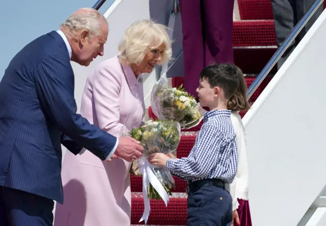 Britain's King Charles and Queen Camilla are welcomed after they disembarked the plane on arrival for a state visit to the United States at Joint Base Andrews, Maryland, U.S., April 27, 2026.