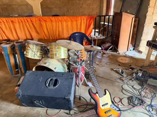Musical instruments scattered inside the church auditorium where bandits abducted about 95 people
