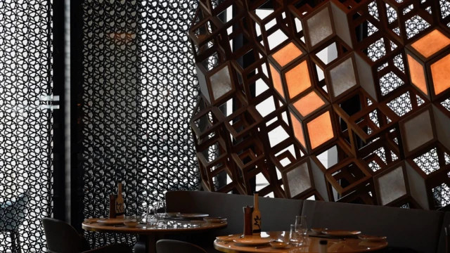 Di facade of di Mandarin Oriental hotel for Doha Qatar dey inspired by mashrabiya lattices - di Arabic counterpart of jaali 