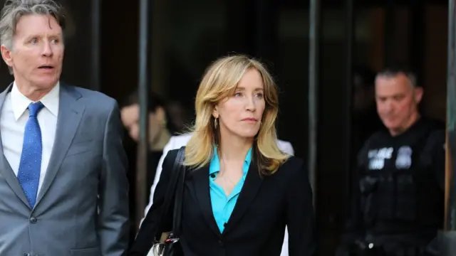 Actress Felicity Huffman, center, leaves the John Joseph Moakley United States Courthouse in Boston on April 3, 2019