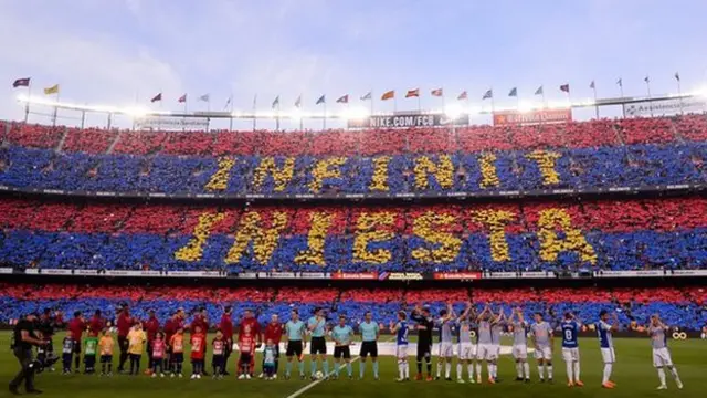 A mosaic message reading 'Forever Iniesta' formed by the Barcelona fans