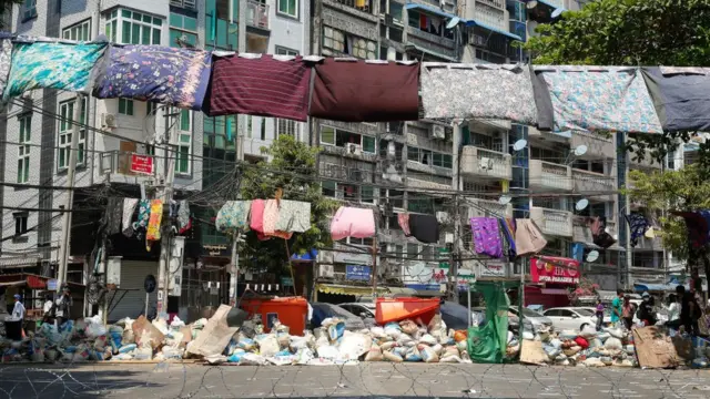 Sarongs hang on washing line in Myanmar