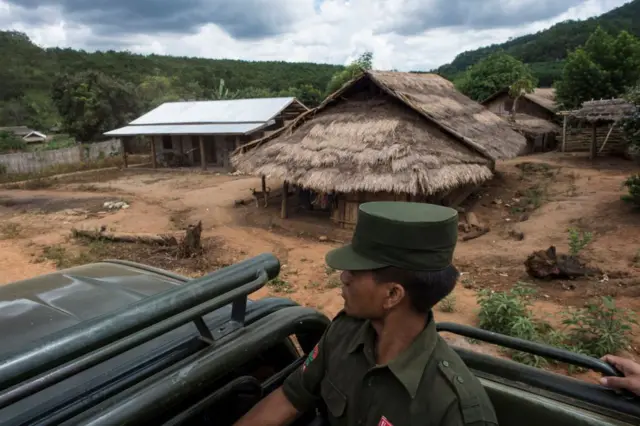 This photo is taken on June 26, 2017 shows members of the United Wa State Army travelling in a convoy in Poung Par Khem region, near the Thail and Myanmar border. The armed group, which has its own autonomous territories on the border with China and Thiland is thought to be one of the largest traffickers in Southeast Asia. / AFP PHOTO / YE AUNG THU (Photo credit should read YE AUNG THU/AFP via Getty Images)
