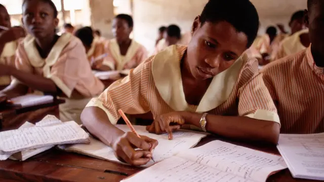 Students dey write for book