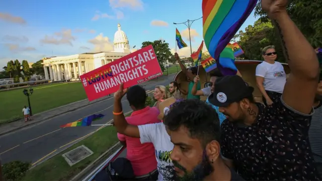 A Sri Lankan man holds a placard which states " LGBTIQ rights are human rights' at Colombo, Sri Lanka on Saturday 17 June 2017