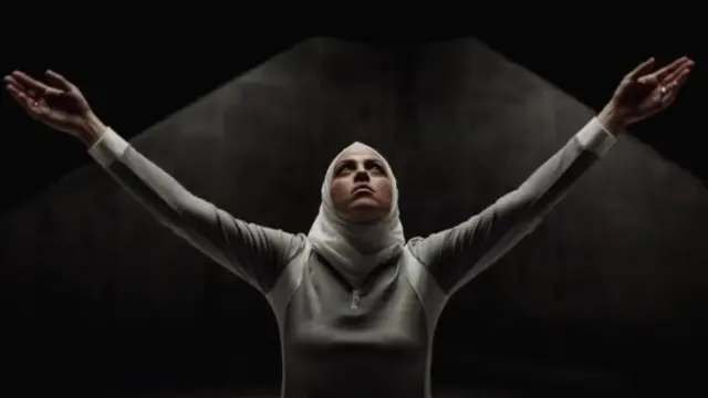 Screen grab from Hoodies ad showing a women in a head scarf