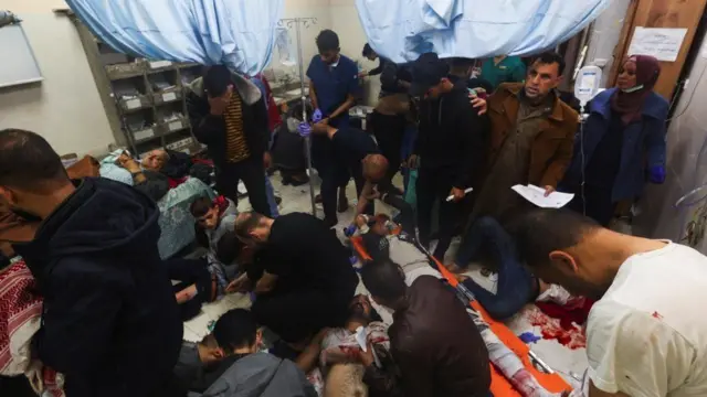 Wounded Palestinians are treated at Nasser Hospital, following Israeli strikes on Ma'an school east of Khan Younis