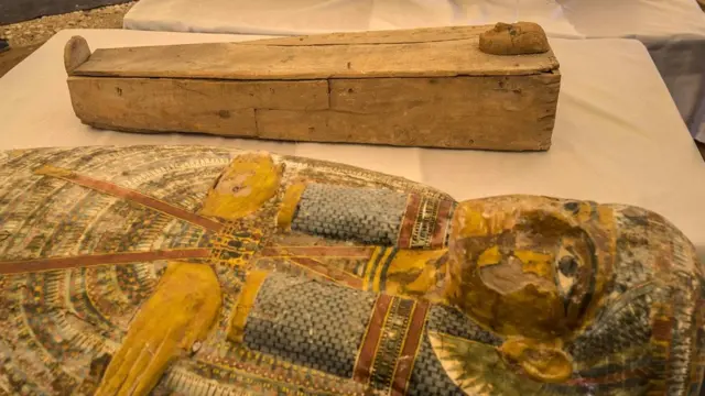 Two sarchophagi, one belonging to a child (top) are displayed in front of Hatshepsut Temple in Egypt"s valley of the Kings in Luxor, on October 19, 2019