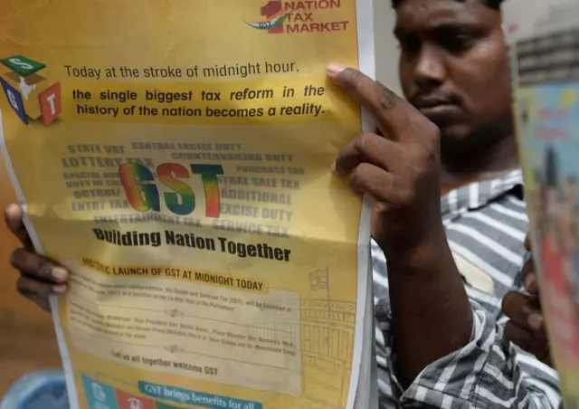 અખબારમાં જીએસટી વિશે માહિતી.