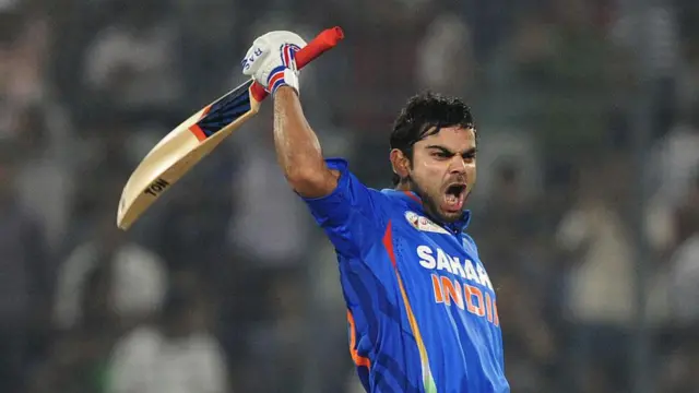 విరాట్ కోహ్లీ, Indian batsman Virat Kholi reacts after scoring a century (100 runs) during the one day international (ODI) Asia Cup cricket match between India and Pakistan at The Sher-e-Bangla National Cricket Stadium in Dhaka on March 18, 2012. 