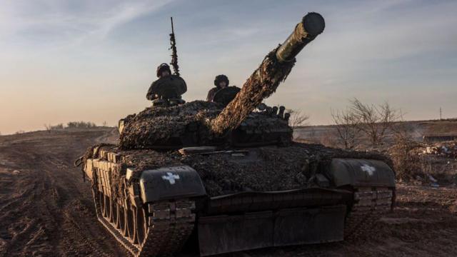 Ukrainian soldiers driving a tank