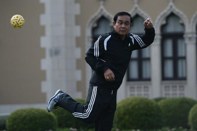 Thailand Prime Minister Prayut Chan-o-cha plays takraw during the weekly exercise campaign at the Goverment House in Bangkok, Thailad