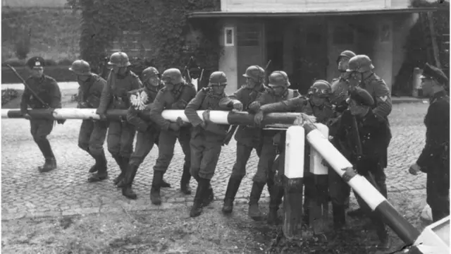 German Soldiers breaking down the border barrier and crossing into Poland at Sopot on September 1, 1939. (Photo by Universal History Archive/Getty Images)