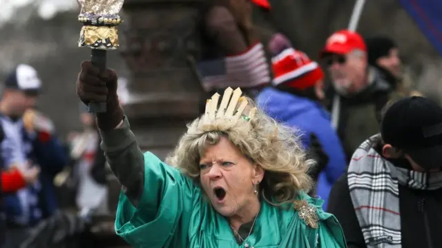 Leigh Ann Luck dressed up as the Statue of Liberty shouts as supporters of President Donald Trump gather near the Capitol building in Washington