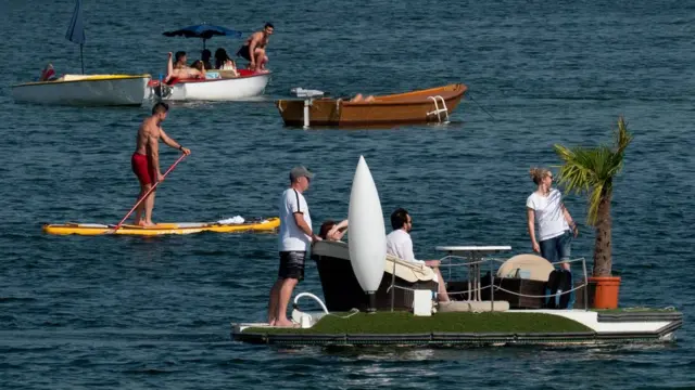 People make their way in pedal boats on the Old Danube (Alte Donnau), a subsidiary of the Danube river, in Vienna, Austria on June 25, 2019