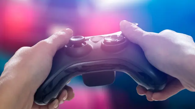 Man holding video game controller