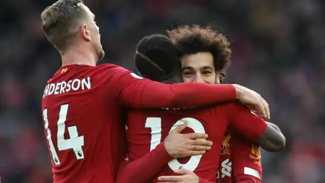 Mohamed Salah dey celebrate im opener for Liverpool with team-mates Sadio Mane and Jordan Henderson