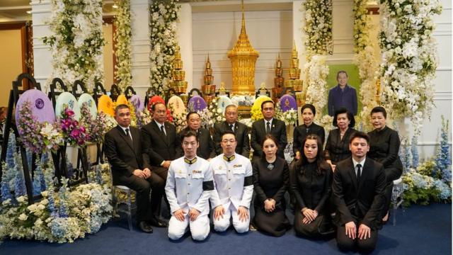 Aiyawatt Srivaddhanaprabha (2nd L, Front) poses with Thailand"s Prime Minister Prayuth Chan-ocha (4th R Back) and his wife Napaporn Chao-ocha (3rd R Back) during the funeral of his father, Vichai Srivaddhanaprabha, late chairman of Leicester City Football Club in Bangkok, Thailand, November 5, 2018.
