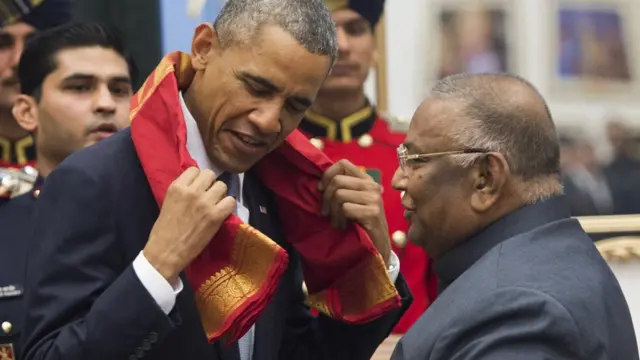 Rayapati Sambasiva Rao, Member of Indian Parliament, presents a scarf to US President Barack Obama in New Delhi, India.