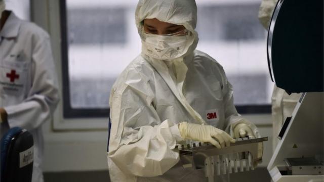 Lab technicians test patient samples for the novel coronavirus at the Centre for Emerging Infectious Diseases of Thailand at Chulalongkorn University in Bangkok on February 5, 2020.