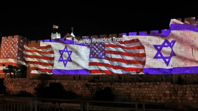 The Israeli and United States flags are projected on the walls of the ramparts of Jerusalem's Old City, to mark the opening of the new US embassy