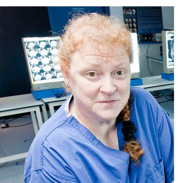 Professor Sue Black wearing scrubs
