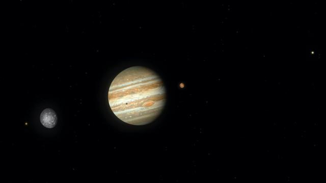 Artwork of Jupiter and its largest four (Galilean) moons. From left to right the bodies are Io, Callisto, Jupiter (with the shadow of Io cast upon it), Ganymede and Europa. The bodies are all shown to the correct scale, as viewed from a distance somewhere beyond the orbit of Callisto