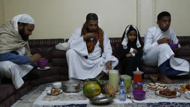 ddisu Gebeya family break their fast during a fast-breaking (iftar) dinner in the first day of Muslim's holy month Ramadan inside their house as mosques and squares are closed due to the coronavirus (COVID-19) pandemic in Addis Ababa, Ethiopia,
