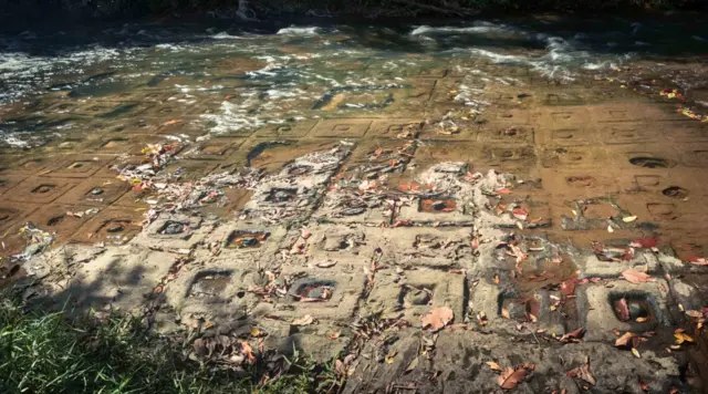 Shiva Lingas carved in Kbal Spean riverbed