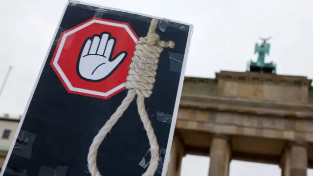 An anti-hanging placard is seen during a protest against the Iranian regime following the death of Mahsa Amini