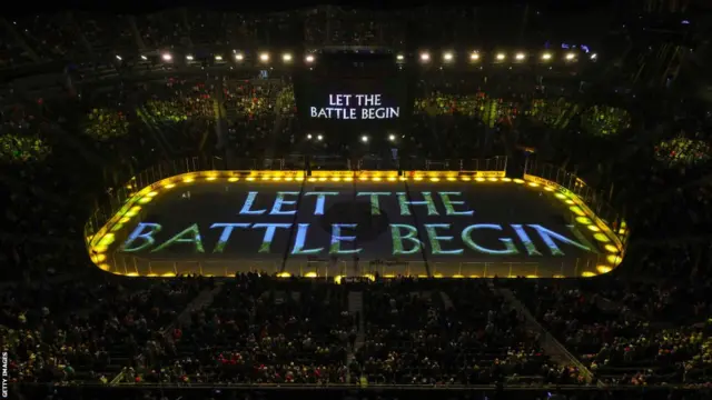 The words Let Battle Begin are projected onto the ice at a Golden Knights home game