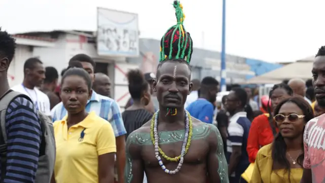 A man adorned in traditional ornaments