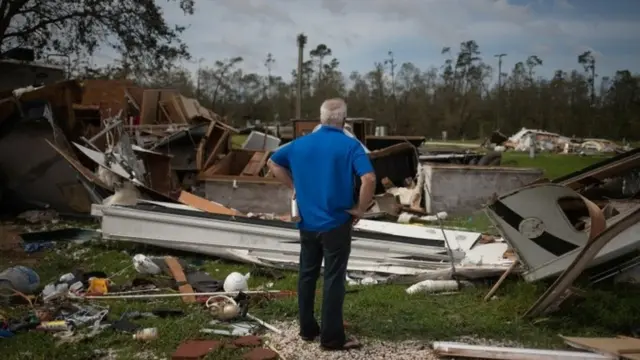 A man surveys the devastation in Sulphur, Louisiana