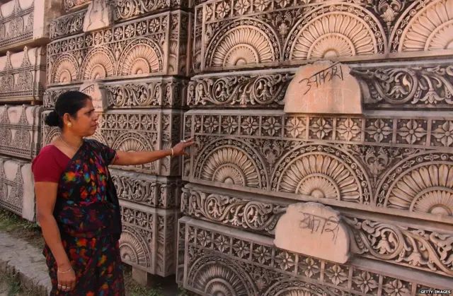 A Hindu woman looks at stone slabs earmarked for the construction of a Hindu temple at a workshop in Ayodhya in 2012.