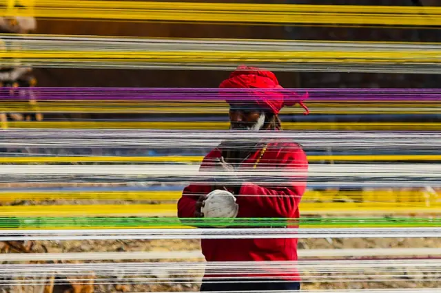 Workers prepare kite-flying thread ahead of the upcoming Basant festival in Lahore, Pakistan, on January 31, 2026. 
