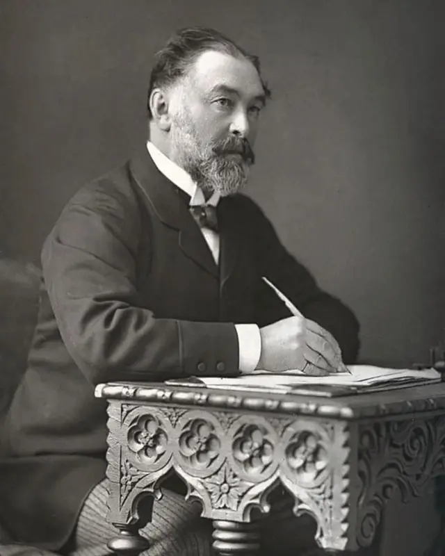 Фредерик Харисон за писаћим столом и пером у руци