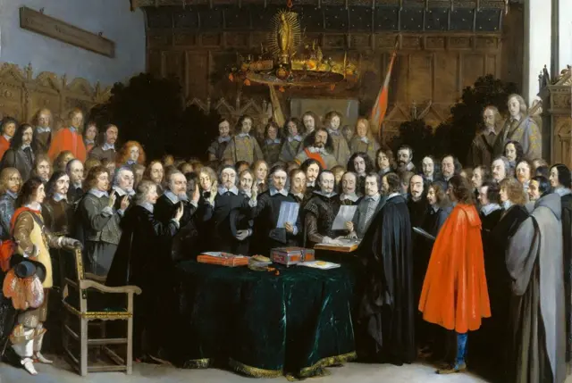 Підписання Мюнстерського мирного договору, картина нідерландського художника Герарда Терборха - на ній багато чоловіків у старовинному одязі стоять у великій залі біля столу