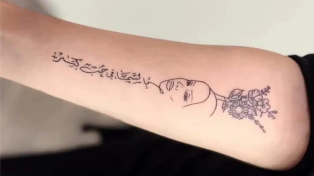 خالکوبی چهره و عبارت «در بهشت عشق فراوان است»