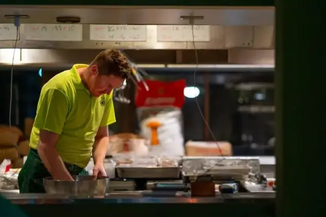 Alan Fisher bend over during im cooking marathon