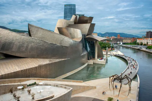 Side view of the Guggenheim Museum, next to the Nervion River, in Bilbao, Spain, 2021. (Photo: Sergi Reboredo/VW Pics/Universal Images Group via Getty Images)