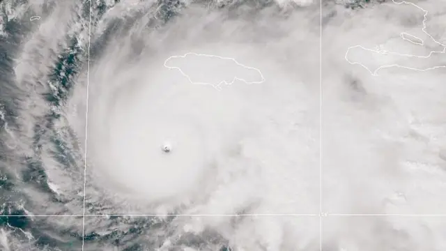 In this handout satellite image provided by the National Oceanic and Atmospheric Administration (NOAA), Hurricane Melissa churns northwest through the Caribbean Sea captured at 17:18Z on October 27, 2025. 