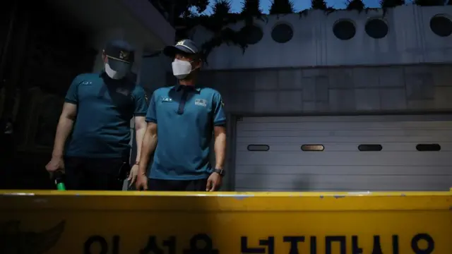 South Korean policemen stand guard in front of Seoul Mayor Park Won-soon"s residence in Seoul, South Korea, July 9, 2020.