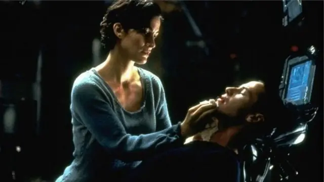 Carrie-Anne Moss and Keanu Reeves