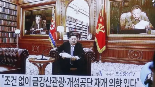 A South Korean person watches a news broadcast reporting on North Korean leader Kim Jong-Un"s New Year"s address, at a shop in Gangneung, Ganwon-province.