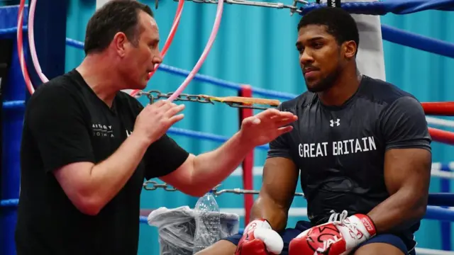 Boxing trainer Rob McCracken and heavyweight boxing champion Anthony Joshua