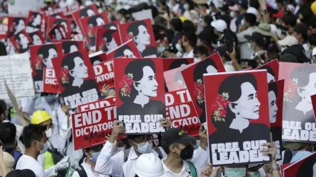 Demonstrators hold placards calling for the release of detained civilian leader Aung San Suu Kyi during a protest against the military coup, in Yangon, Myanmar, 25 February 2021