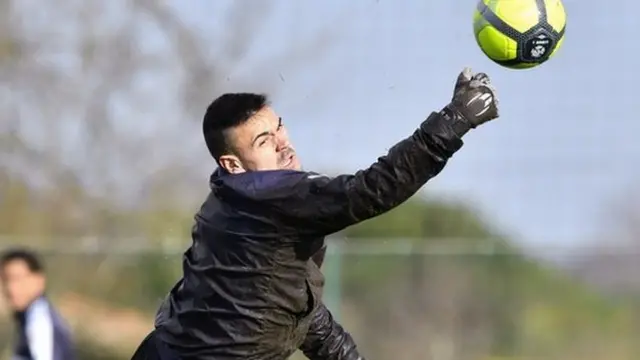 Goalkeeper Jerome Prior dives for a ball in 2018