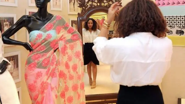 woman combing her hair in a mirror