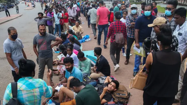 People wait to apply for their passport at Sri Lanka's Immigration and Emigration Department, amid the country's economic crisis, in Colombo, Sri Lanka, July 07, 2022.