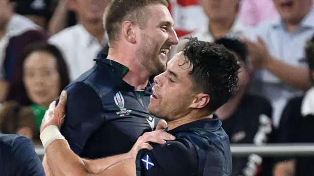 Scotland's Finn Russell and Sean Maitland celebrate